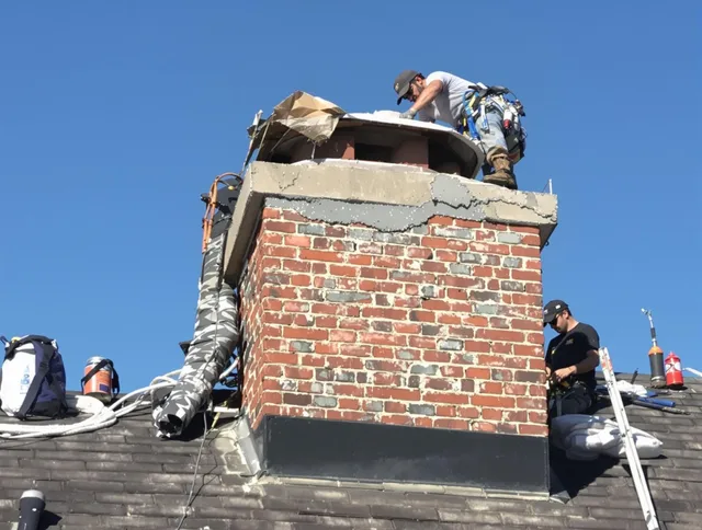 Ipswich Chimney Sweep installing a custom chimney crown in Ipswich, MA
