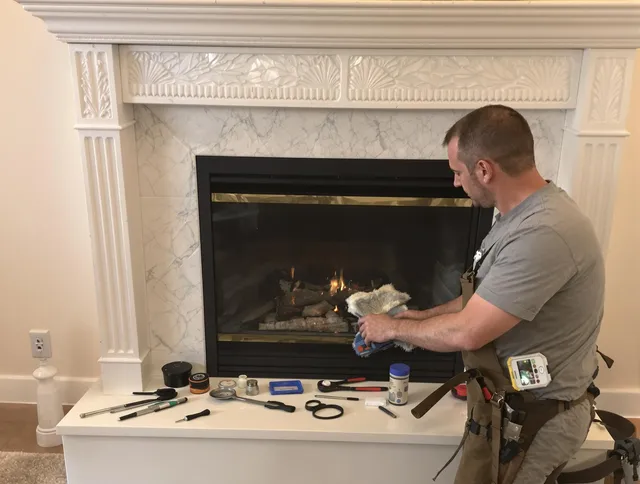 Ipswich Chimney Sweep performing fireplace maintenance in Ipswich, MA