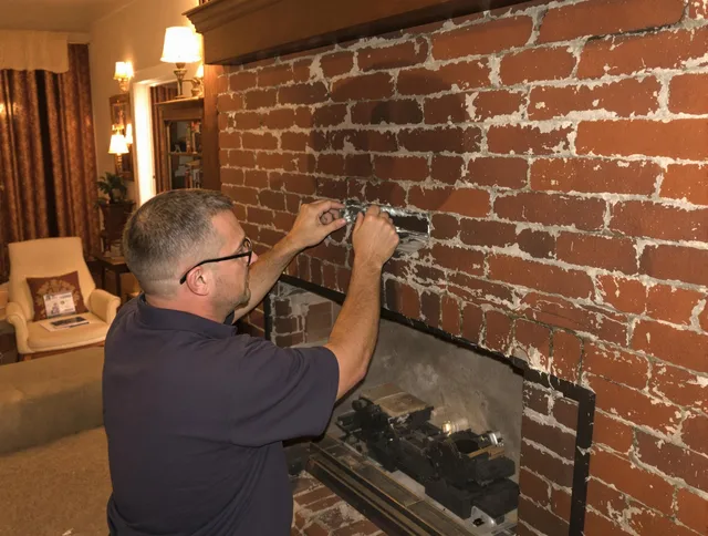 Ipswich Chimney Sweep expert fixing a fireplace in Ipswich, MA